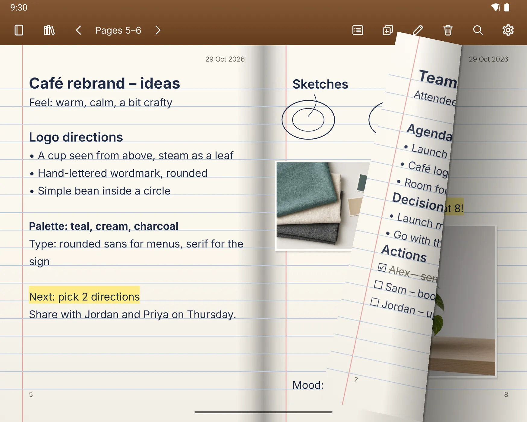 A page half-turned on the unfolded screen, curling over the café ideas spread to show the meeting notes behind